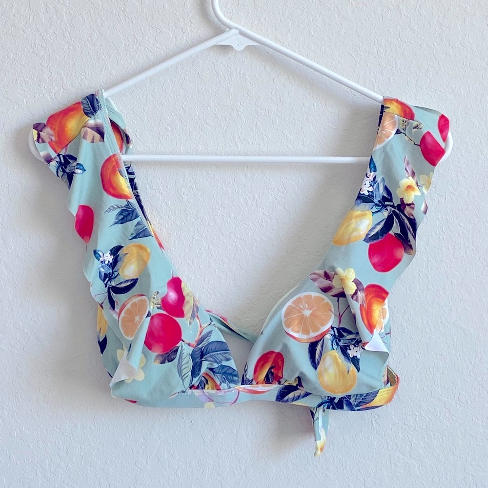 Kona Sol size Small swim top with adjustable straps and tie back.  NWOT